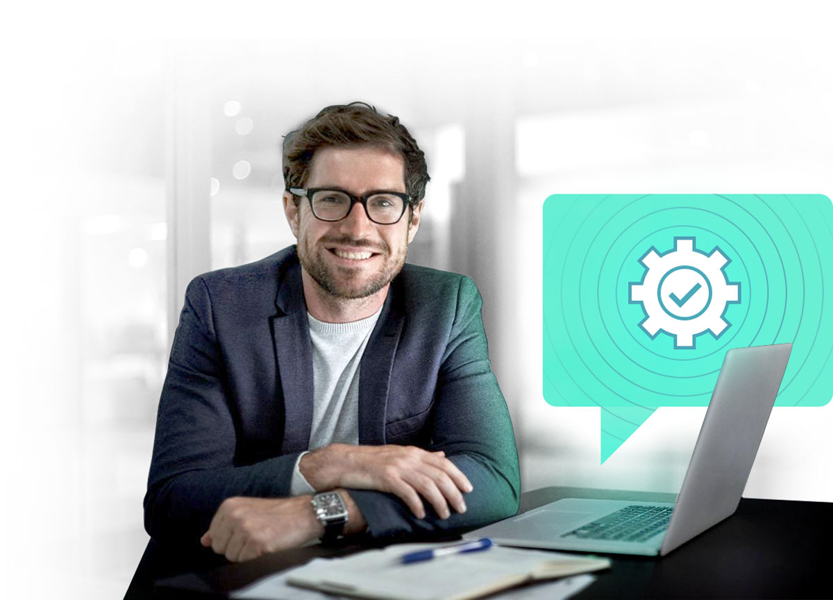 Smiling support employee at a notebook, with a speech bubble showing a gear and a check mark